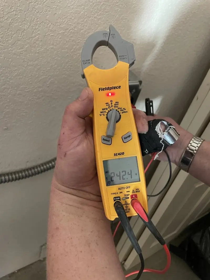 Voltage testing with clamp meter during Outlet Installation in Independence